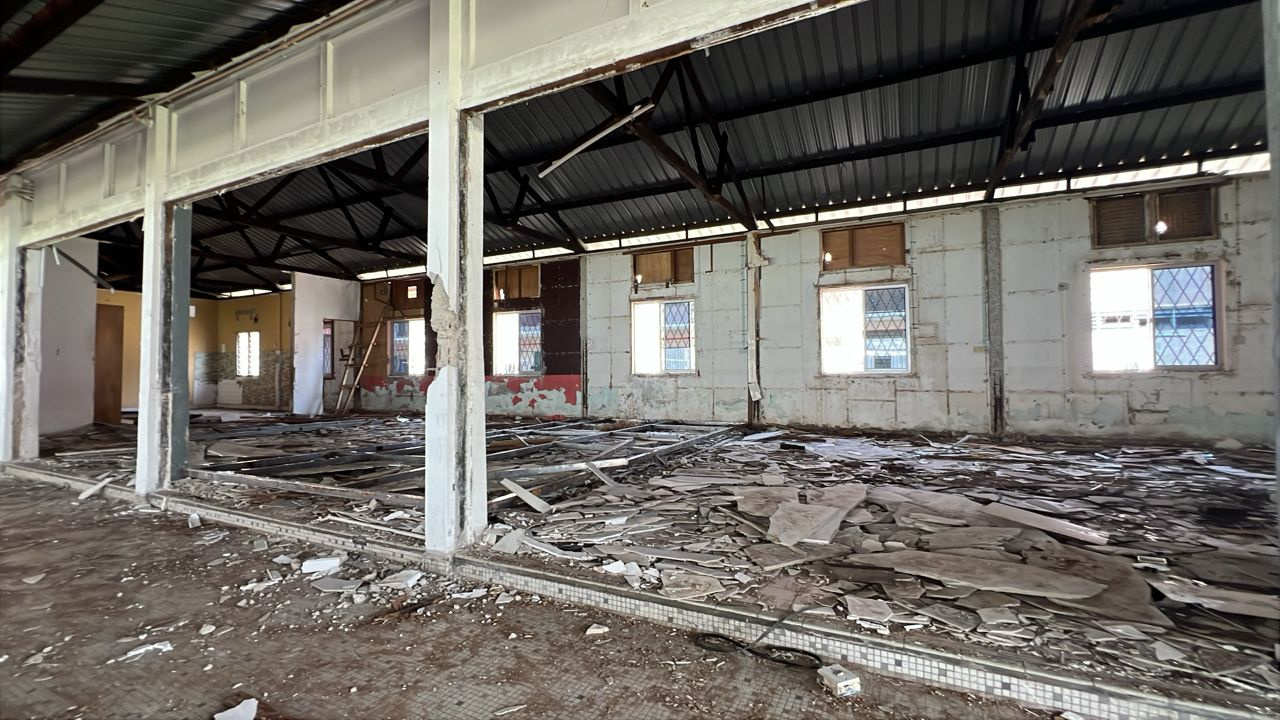 Before renovation — damaged interior